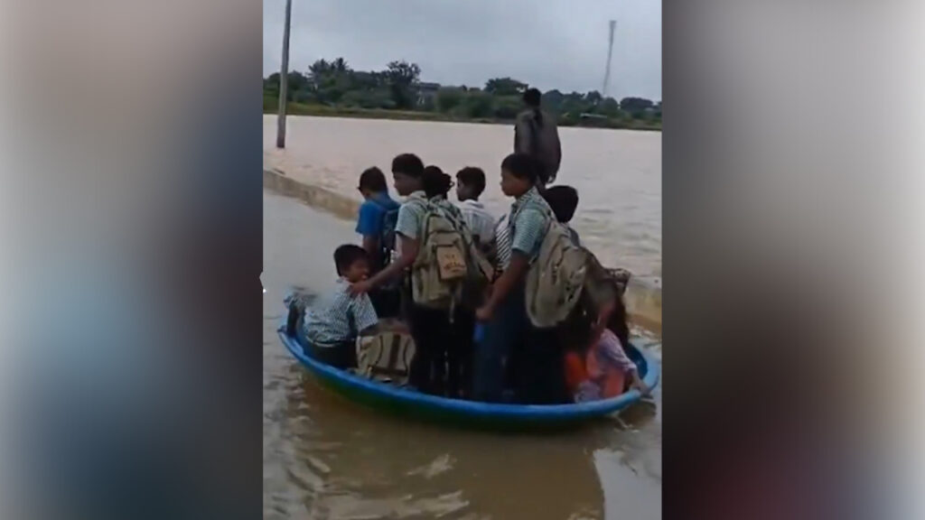 students-cross-flood-telangana-video