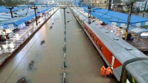 Warangal Railway Station submerged under floodwater after heavy rains from Montha Cyclone, with halted trains and waterlogged tracks