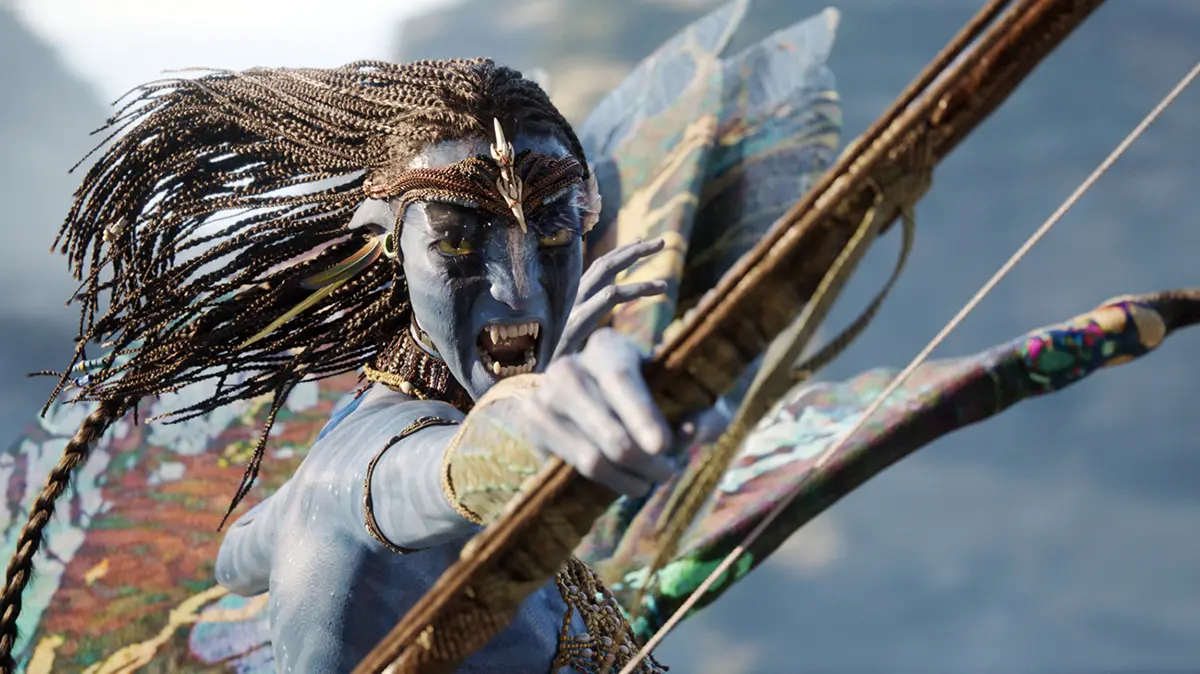 A Na’vi warrior woman aiming her bow in a high-stakes combat moment from Avatar: Fire and Ash