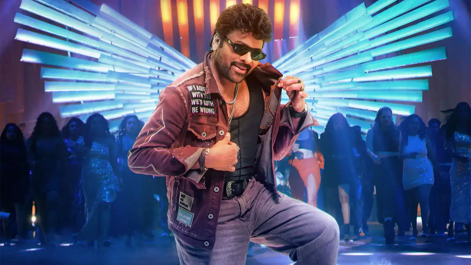 Chiranjeevi dance still with neon blue wings background from Mana Shankara Vara Prasad Garu.