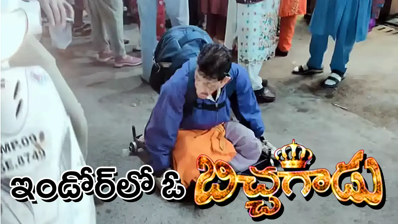 Mangilal moving on a wheeled board in Indore’s Sarafa Bazaar during the anti-beggary operation.