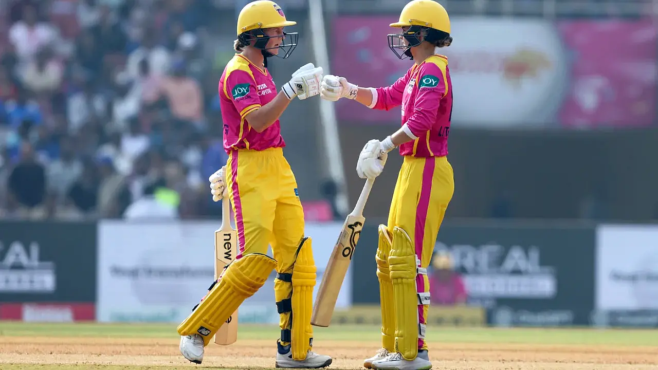 Meg Lanning and Phoebe Litchfield celebrate a century stand as UP Warriorz dominate Mumbai Indians in WPL 2026.
