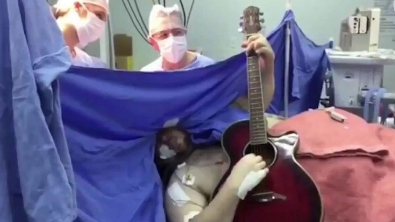 Musician plays guitar during brain surgery