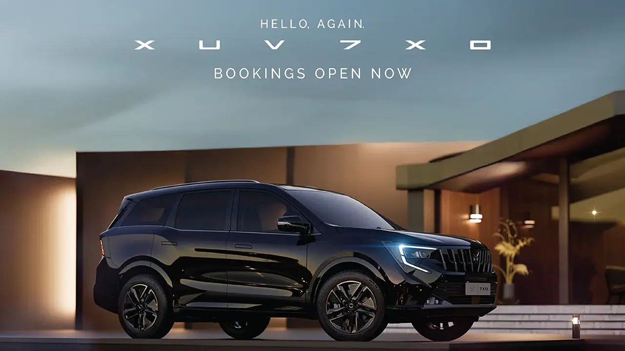 Mahindra XUV 7XO black SUV booking open now luxury house background