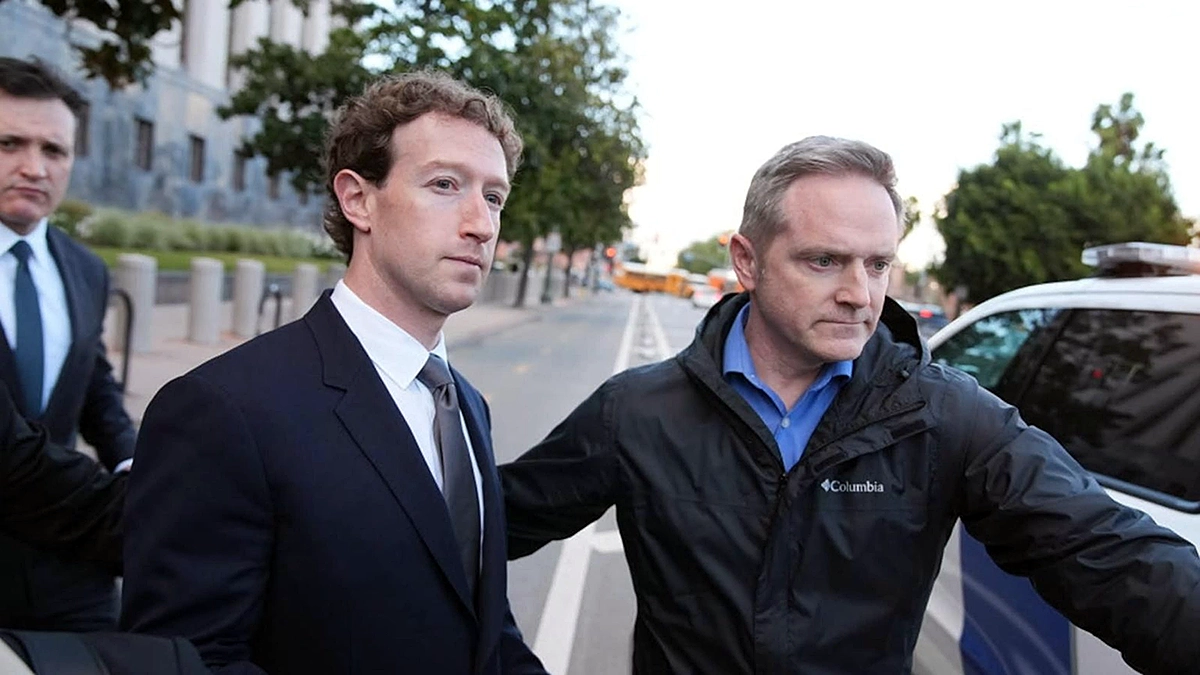 Meta CEO Mark Zuckerberg walking outside Los Angeles Superior Court during the 2026 social media addiction trial, wearing a dark suit and escorted by security and lawyers; serious expression amid media presence, related to Instagram's impact on teen mental health.