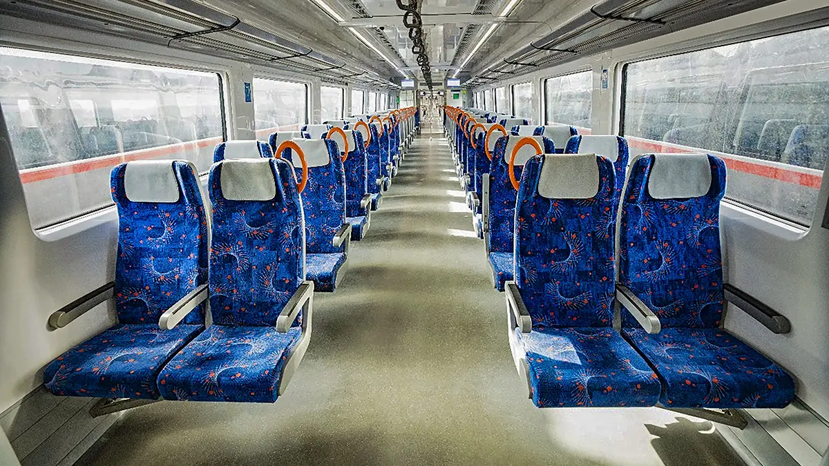 Interior view of Namo Bharat RRTS train showing modern seating and passenger facilities