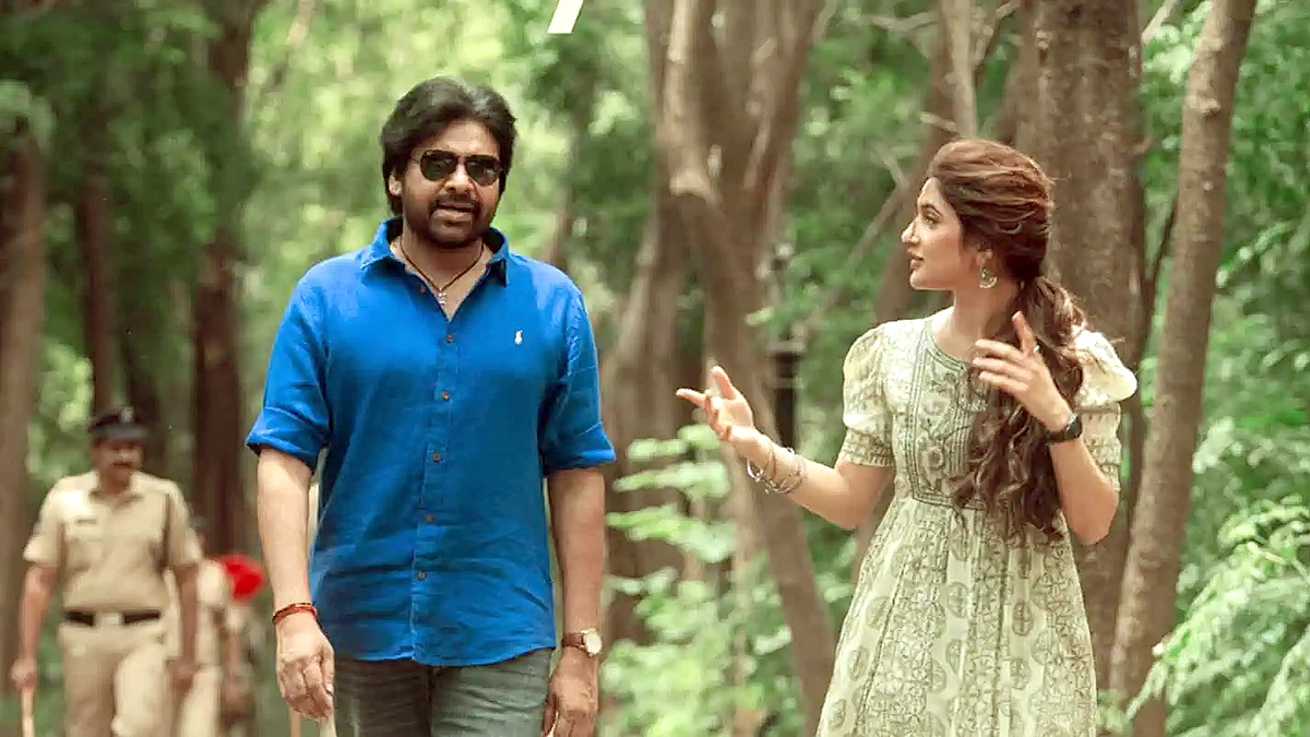 Pawan Kalyan and Sreeleela walking in forest scene from Ustaad Bhagat Singh movie