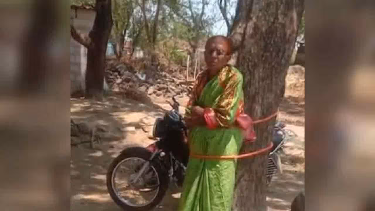Anganwadi Teacher | భ‌ర్త చేసిన త‌ప్పుకు.. అంగ‌న్‌వాడీ టీచ‌ర్‌ను చెట్టుకు క‌ట్టేశారు