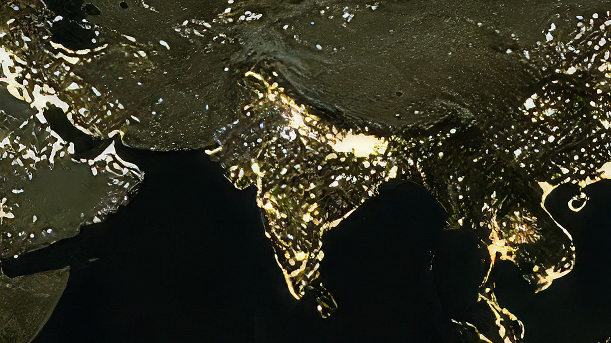 Close-up NASA satellite image showing India glowing brightly at night with UP Bihar belt visible