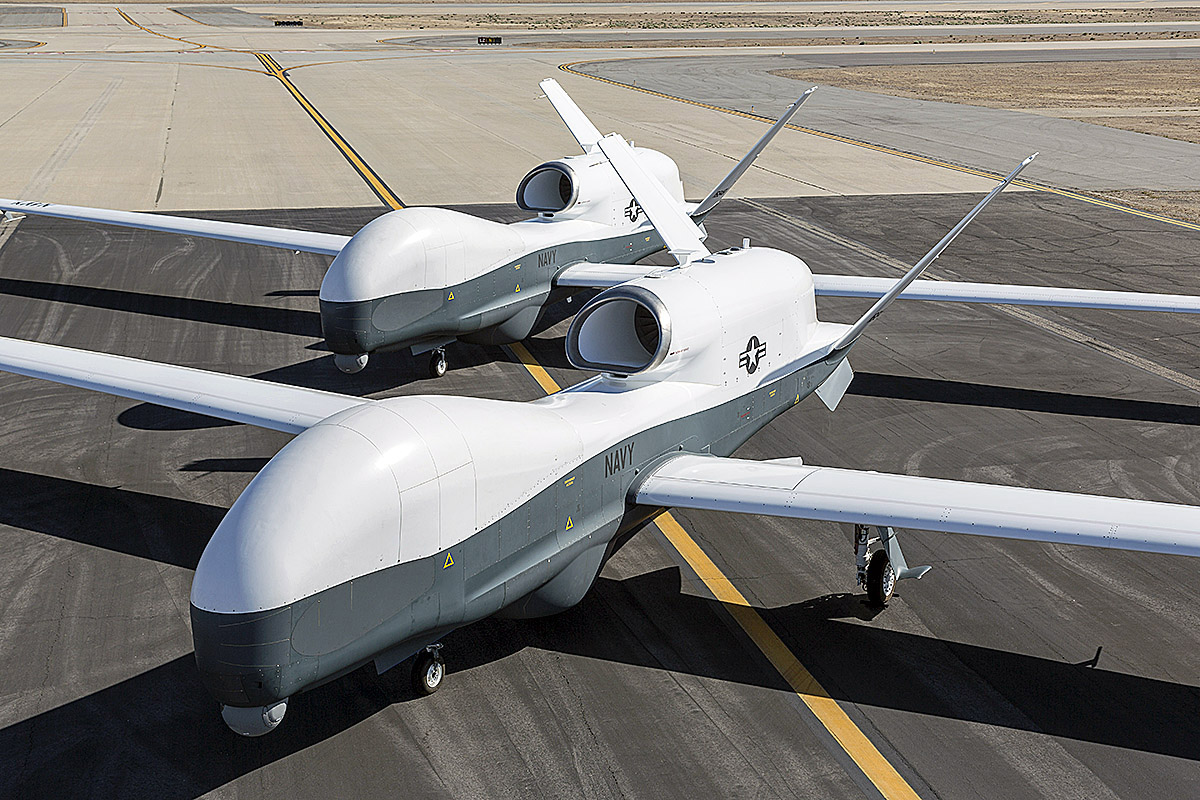 Two MQ-4C Triton drones on runway US Navy unmanned aerial vehicles