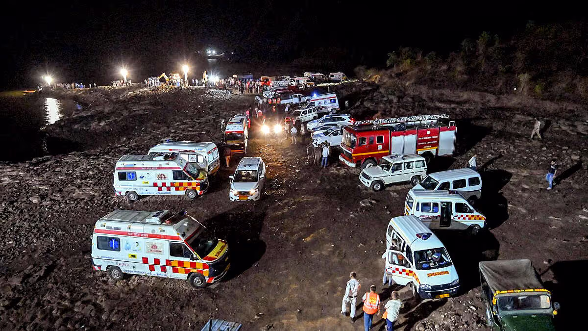 Emergency rescue teams and ambulances deployed at Bargi Dam accident site at night