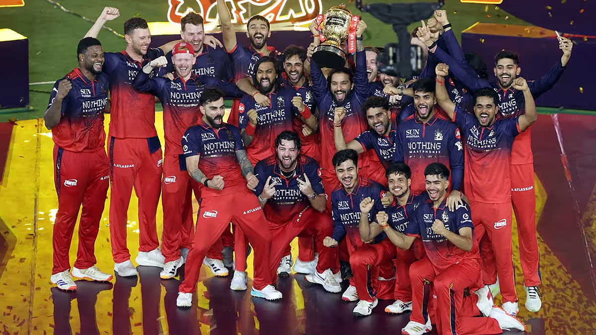 Royal Challengers Bengaluru players celebrate with the trophy after winning the IPL 2026 final