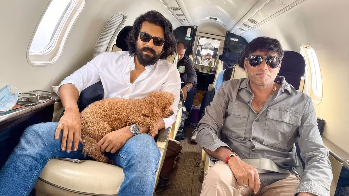 Ram Charan and cinematographer R Rathnavelu traveling in flight during Peddi movie schedule