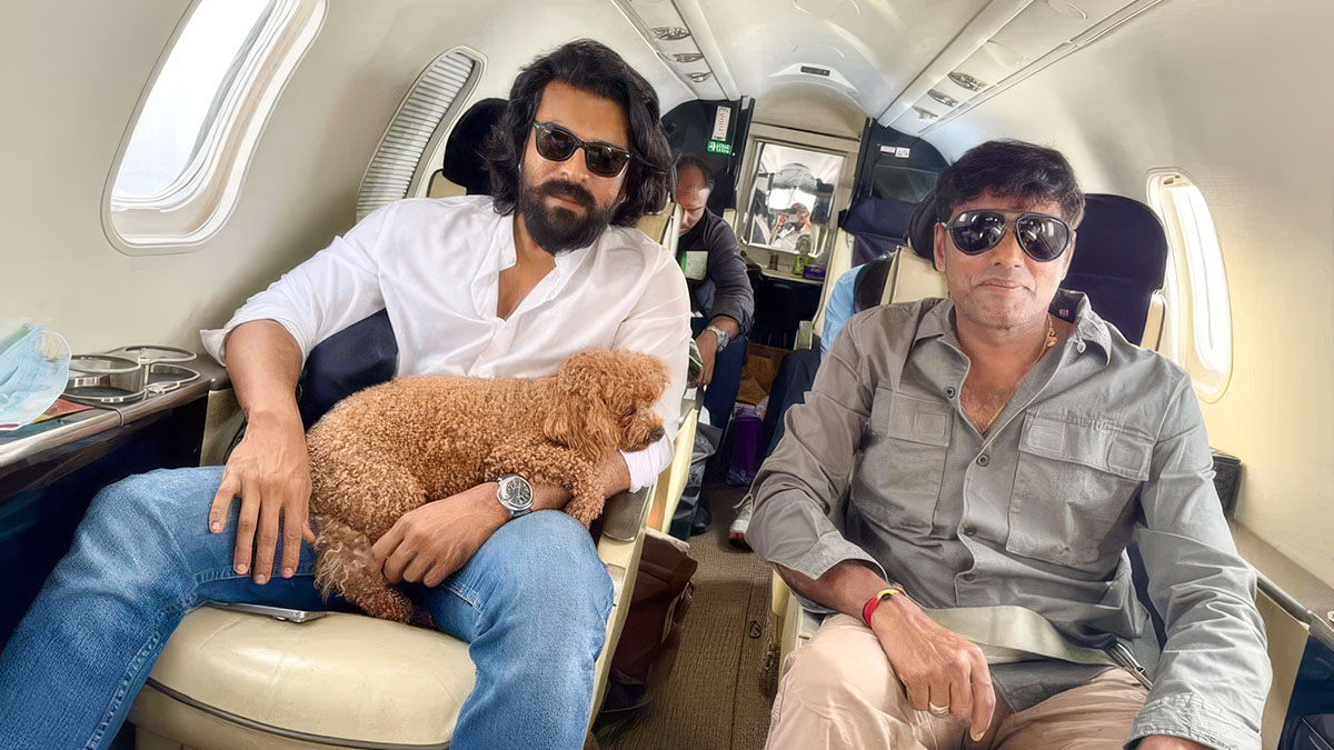 Ram Charan and cinematographer R Rathnavelu traveling in flight during Peddi movie schedule