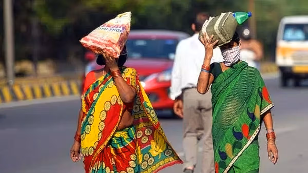 Women protecting themselves from scorching heat on Telangana roads