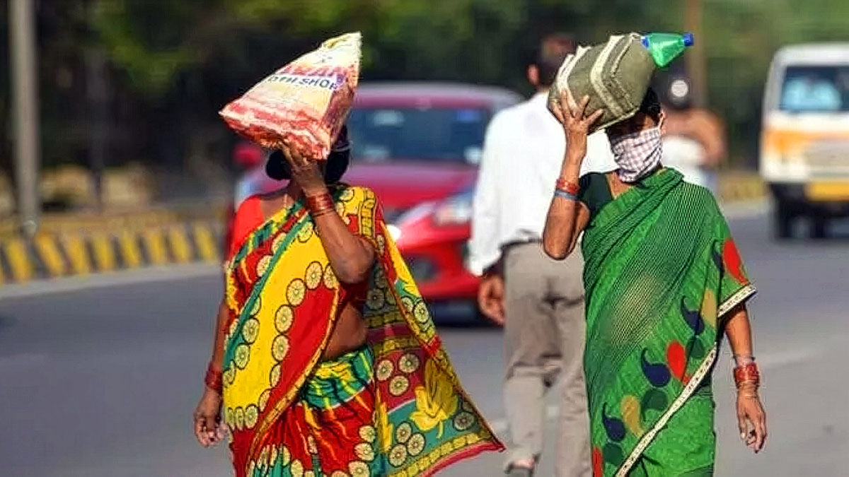 Women protecting themselves from scorching heat on Telangana roads