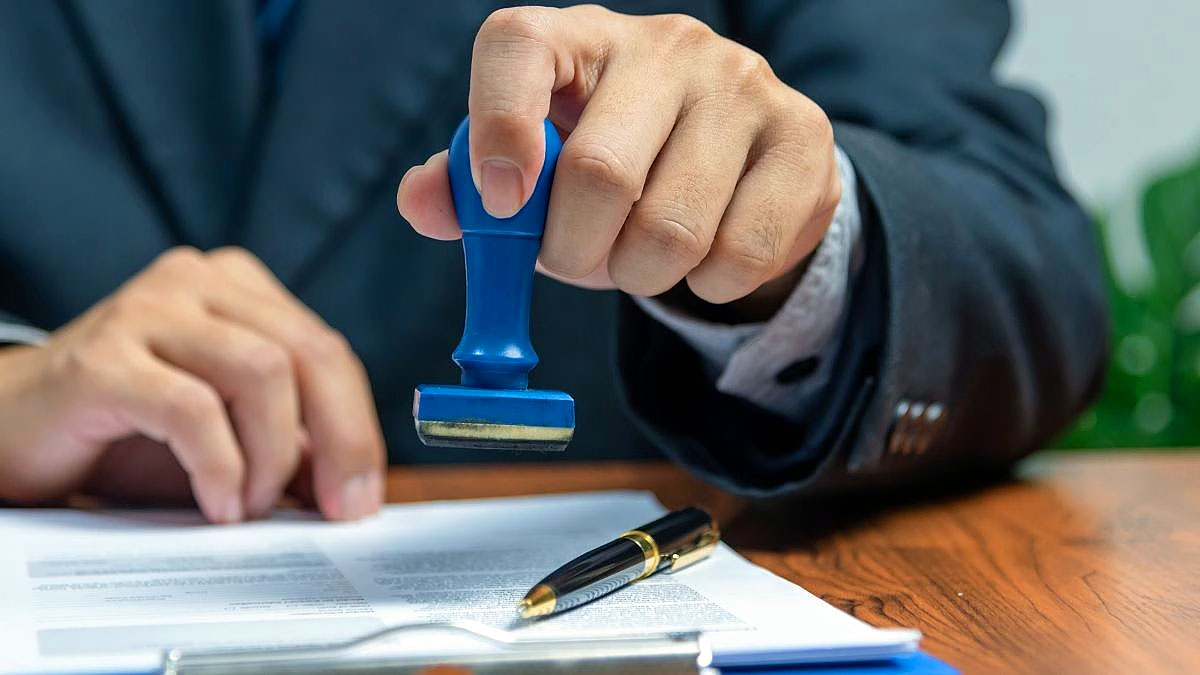 US visa application document being stamped for immigration processing